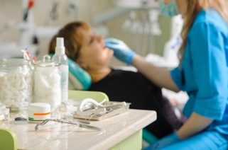 Woman getting teeth exam by a dentist | Avalon Dental, your Carson and El Segundo Dentist