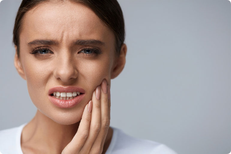 Woman with tooth pain | Avalon Dental, your Carson and El Segundo Dentist